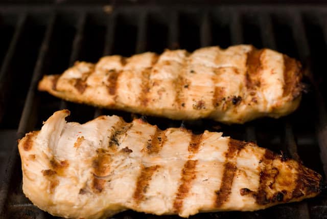 chicken breasts with grill lines on grill