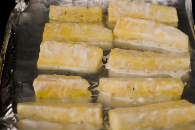 slices of pineapple in aluminum foil