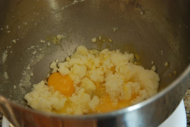 Eggs added to sugar butter mixture in mixing bowl