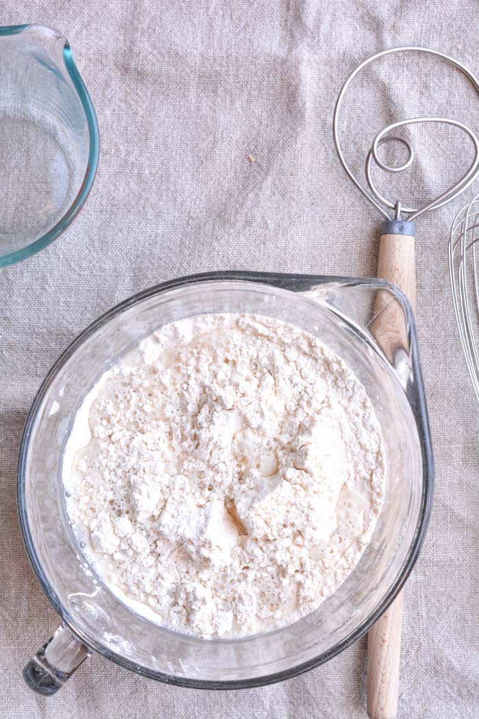 No knead crusty bread ingredients in a bowl with water