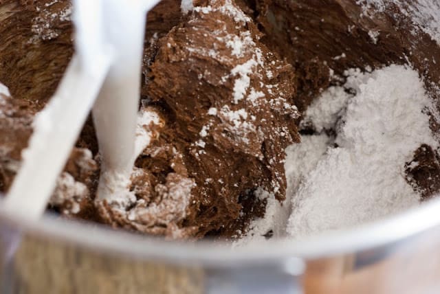 chocolate frosting mixing with powder sugar