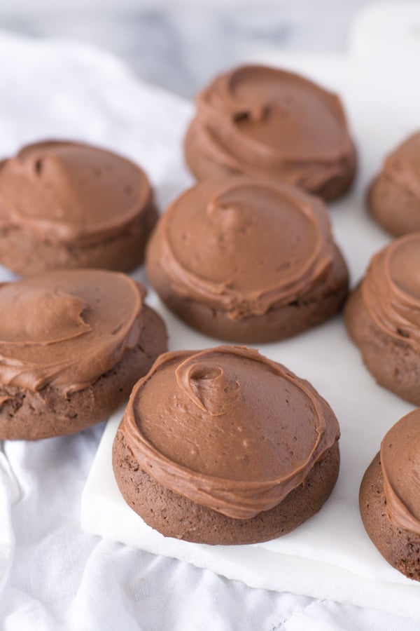 Several chocolate drop cookies with chocolate icing