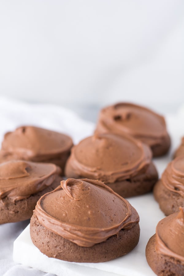 Several iced chocolate cookies on white back ground