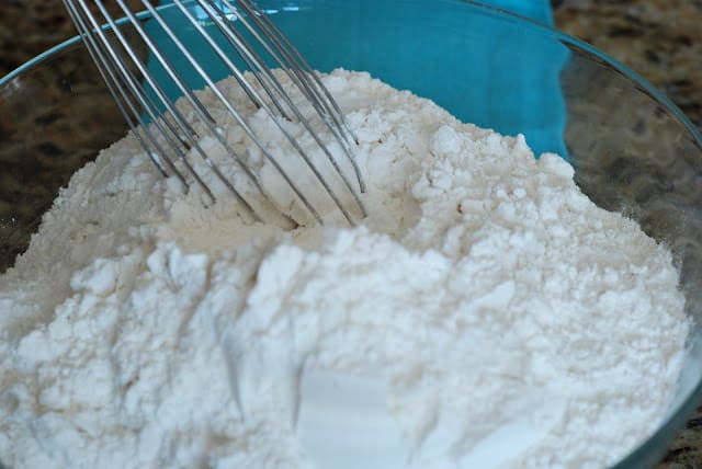 Wire whisk in flour