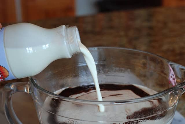 Cream pouring into strained chocolate mixture