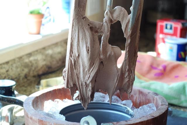 Ice cream dasher lifting covered with chocolate ice cream