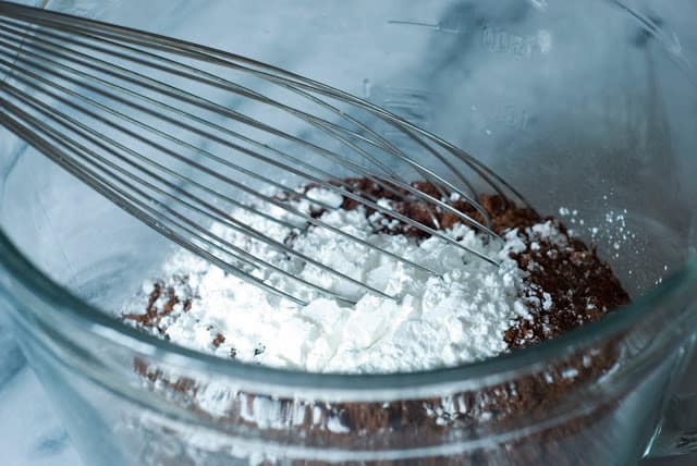 bowl with sugar, cornstarch, and cocoa with wisk