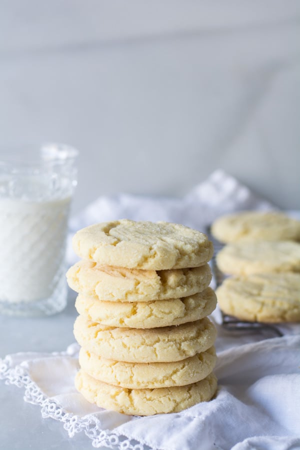 stacked sugar cookies glass of milk