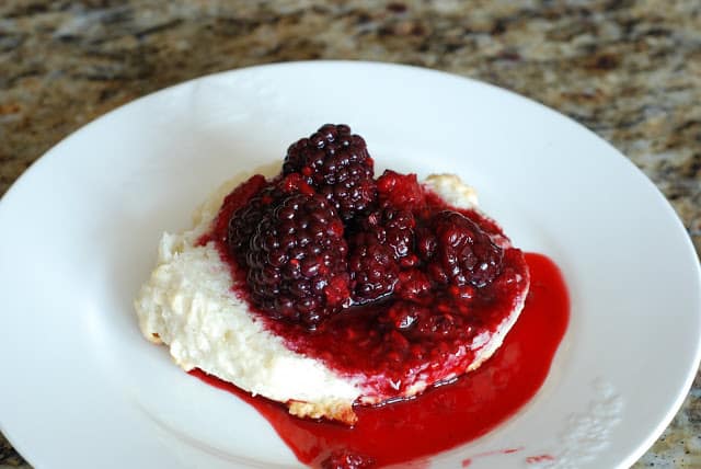 bottom half of biscuit topped with cooked berry mixture