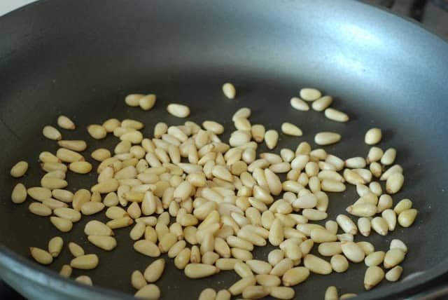 skillet with pinenuts