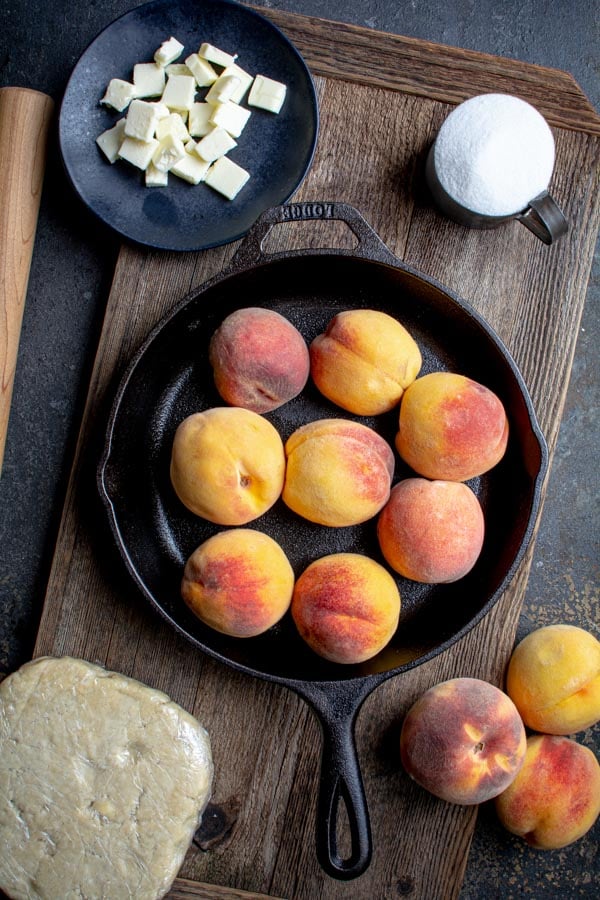 cast iron skillet filled with fresh peaches