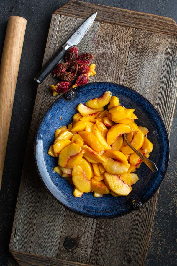 Large blue bowl with peach slices