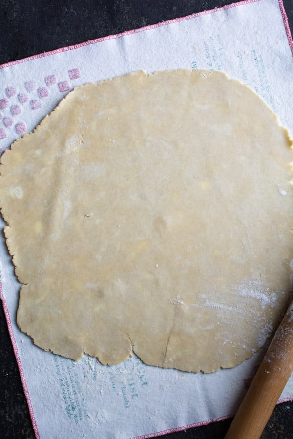 Rolled out pie crust dough into a large circle