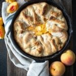 Baked southern peach cobbler on a wooden board