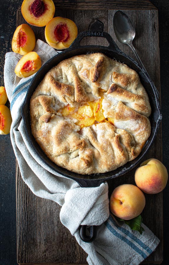 Baked southern peach cobbler on a wooden board