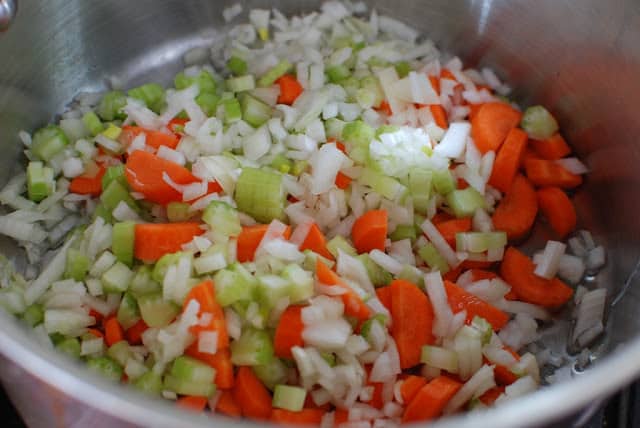 Chopped carrots, celery, and onions in a large pot