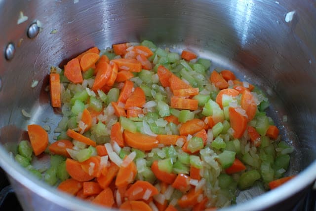 Sauteed onions, carrots, and celery in large pot