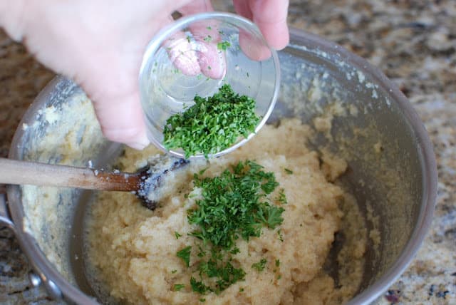 Fresh parsley added to dumpling mixture