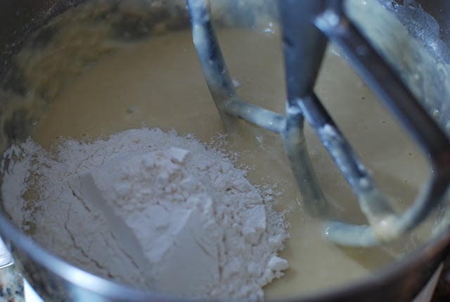 Flour added to mixing bowl with milk yeast mixture