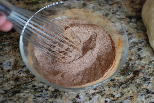 Sugar and cinnamon mix in a bowl