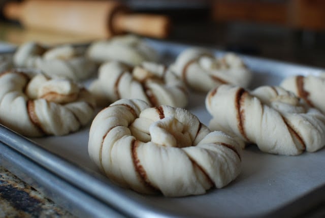 Cinnamon twists on baking sheet lined with parchment paper