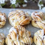 Close up shot of glazed cinnamon twists on wire rack