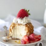 fried ice cream with spoonful taken out with honey and berries