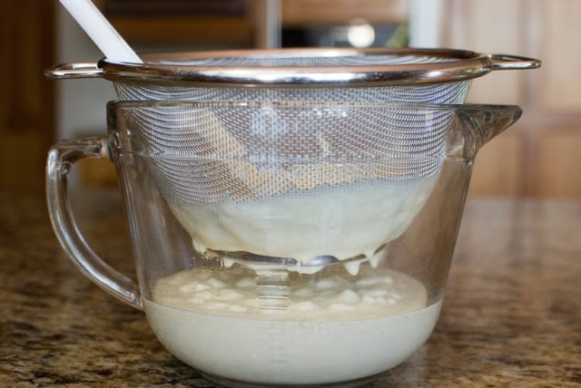 glass bowl with ice cream custard straining