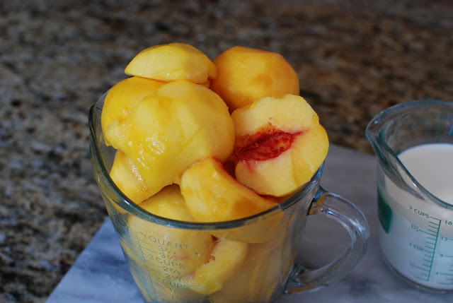 Measuring cup filled with peaches