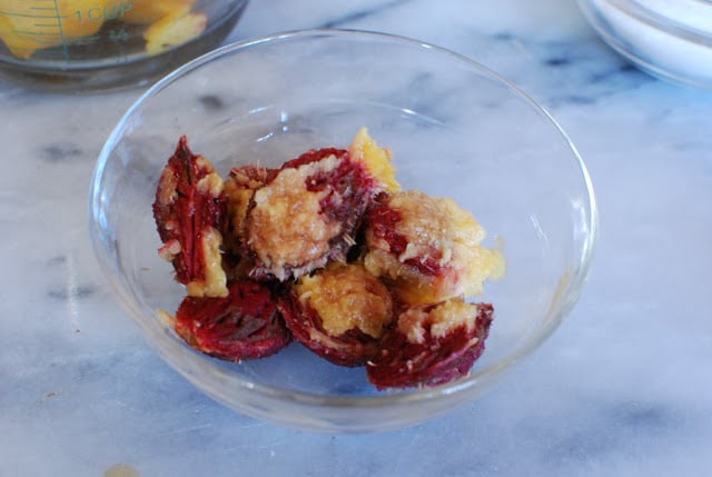 Peach pits in a glass bowl