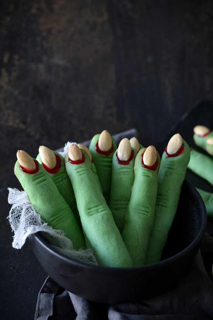 Creepy Witch Finger Cookies standing in a black bowl