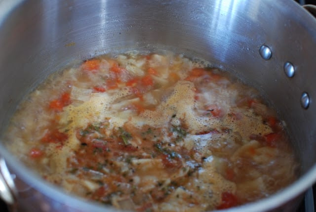 simmering tortilla soup in large pot