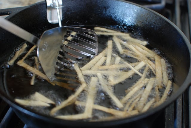 Frying tortilla strips on hot oil