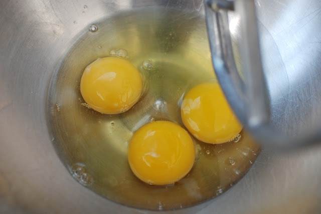 three eggs in mixing bowl