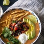 top view of turkey tortilla soup with toppings