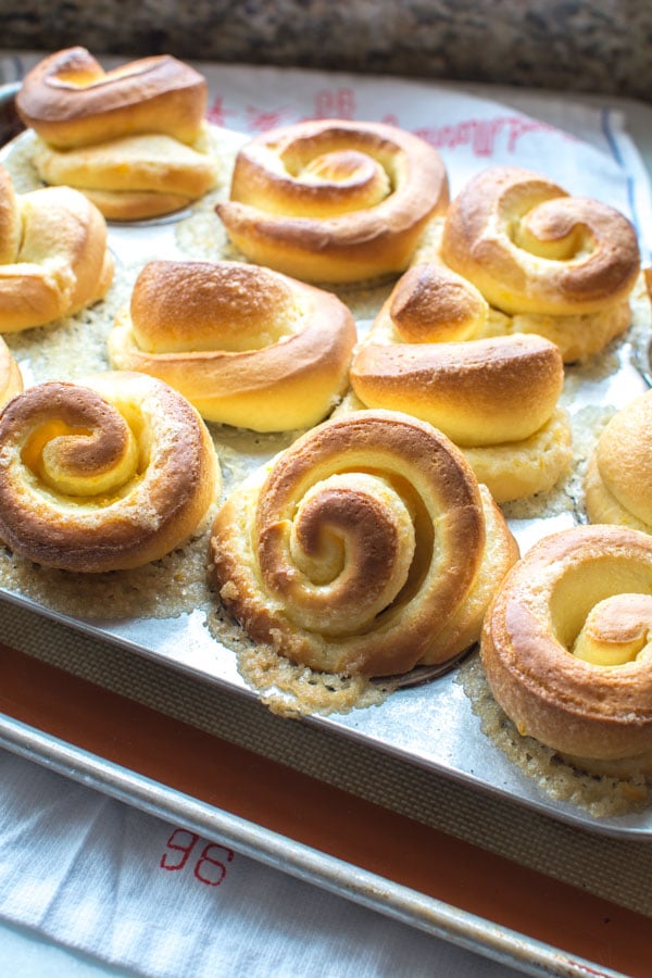 baked orange rolls in muffin tin