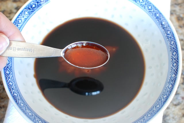 bowl with soy sauce and spoonful of oil