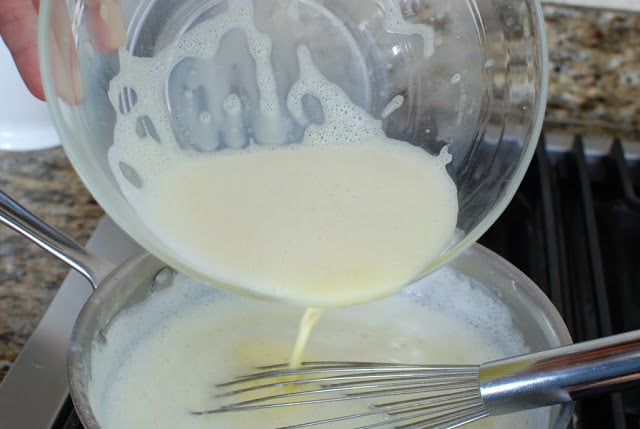 Pouring egg mixture into milk mixture