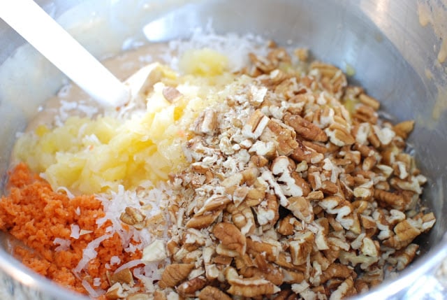 crushed pineapple, nuts, carrots in bowl