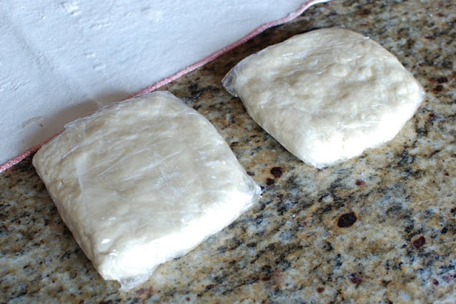 Two discs of apple pie dough .