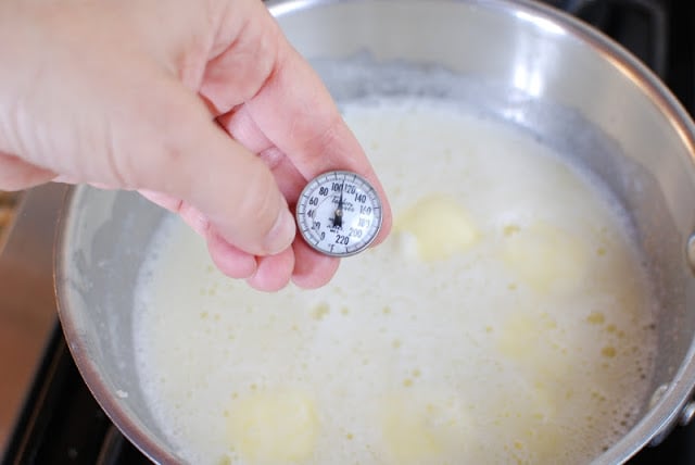 instant read thermometer in milk mixture