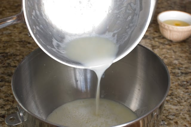 Pouring milk mixture into mixing bowl