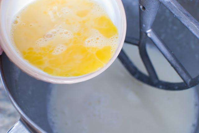 Beaten eggs in bowl over mixing bowl