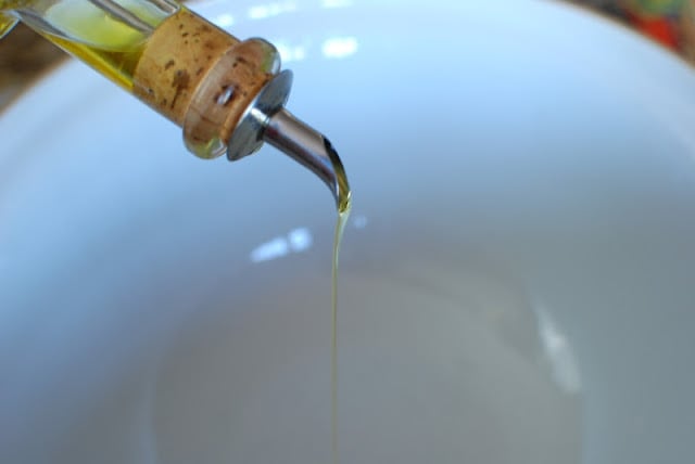 oil pouring into bowl