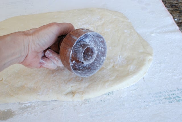 Floured donut cutter cutting Spudnut dough