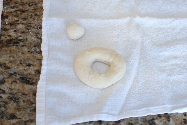 Cut spudnut and donut hole on floured white cloth