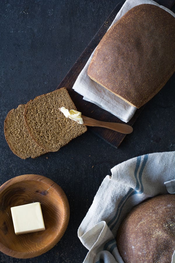 Sliced bread with spreader and butter