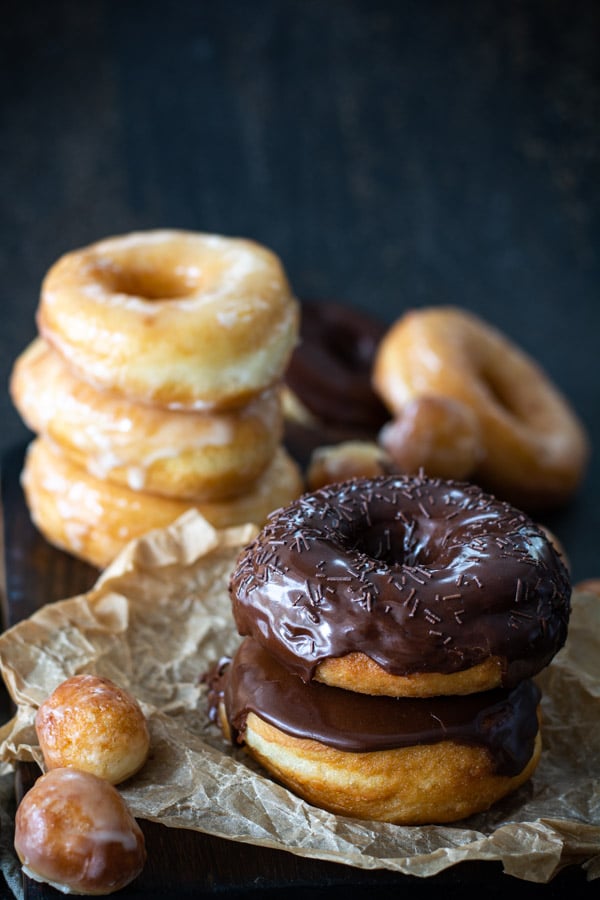 front view of stack chocolate glazed donuts