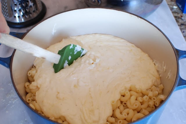 Cream mixture pour on top of cooked macaroni in pot