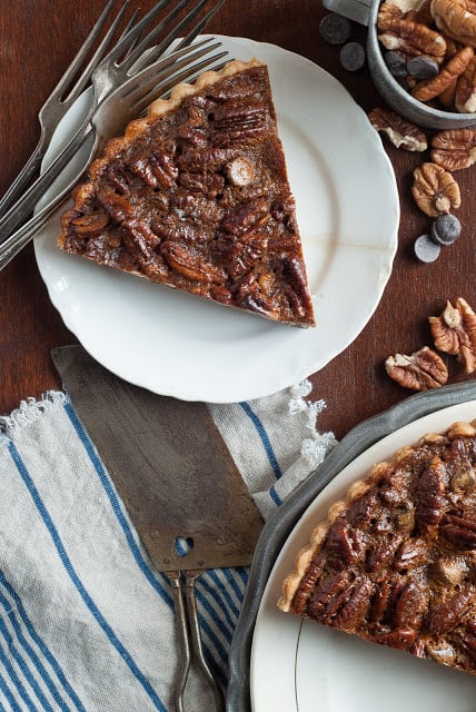 Slice of pecan chocolate tart on plate